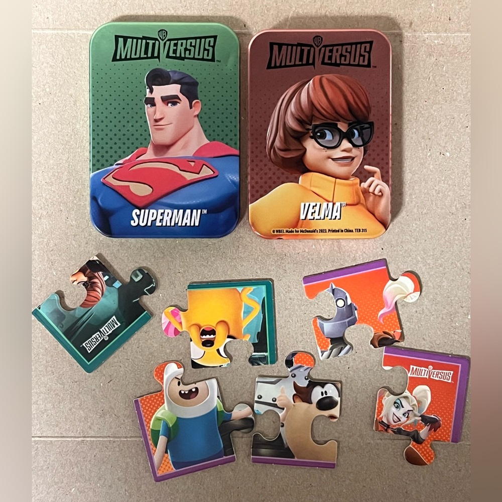 MultiVersus Superman & Velma Puzzle Tin Set versus McDonald’s Warner Bros 2023